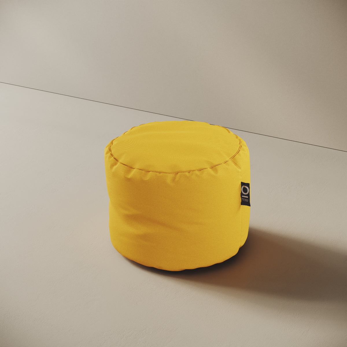 Pouf Adapto giallo, vista laterale — forma cilindrica stabile, ideale come seduta o poggiapiedi