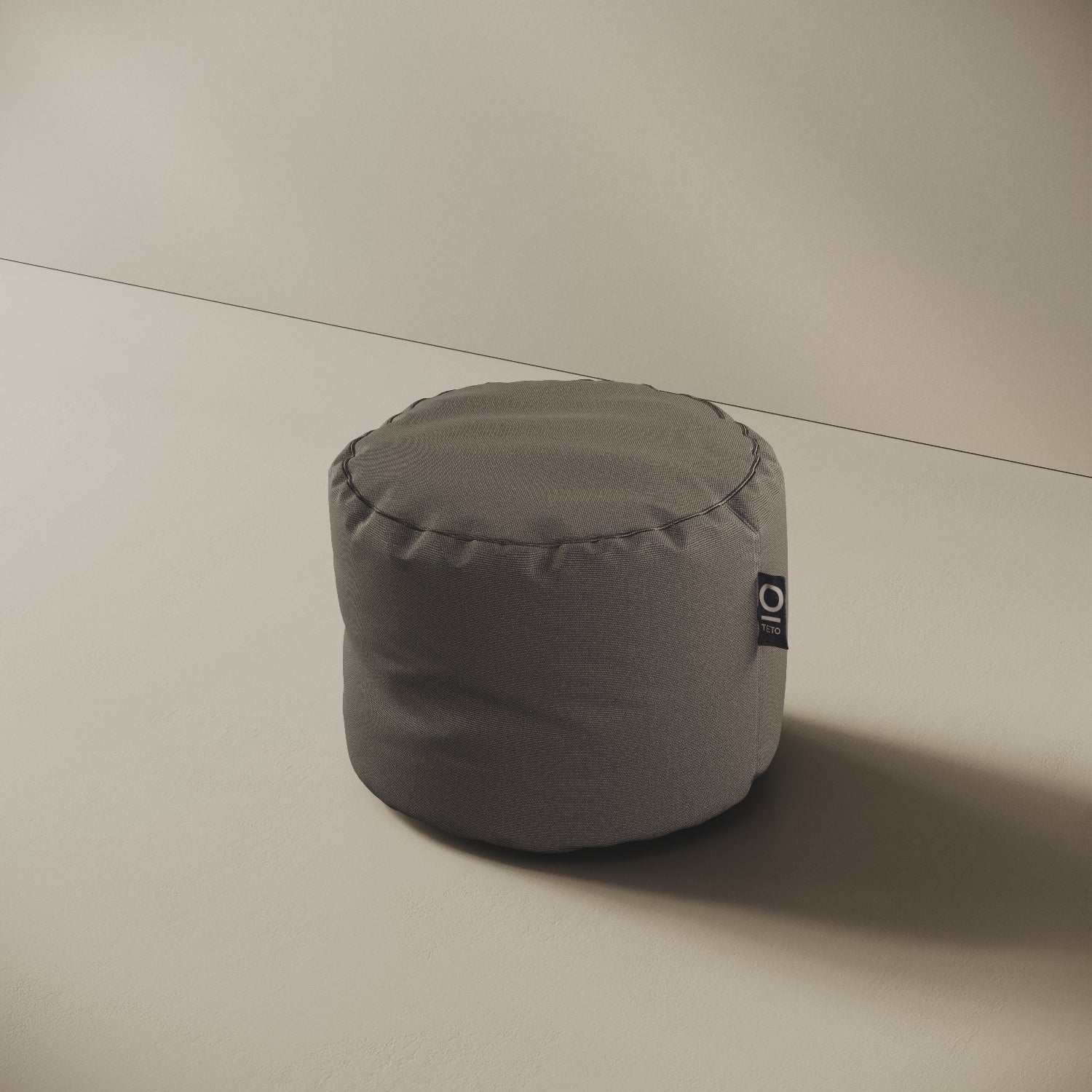 Pouf Adapto grigio, vista laterale — forma cilindrica stabile, ideale come seduta o poggiapiedi